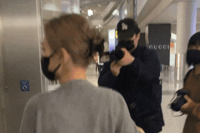 'What do you want?' Gillian Chung backs away from stranger who approaches her at airport